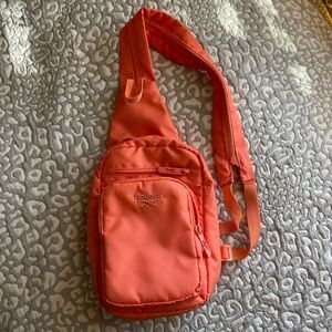 Reebok Coral Orange Sling Outdoor Zipper Purse Pack